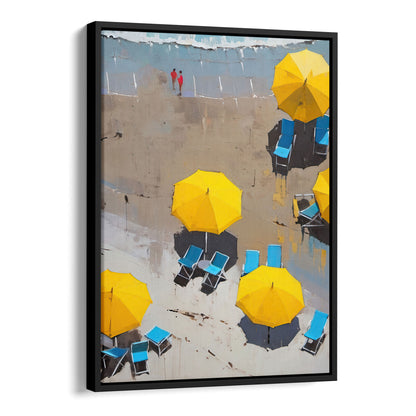 Painting of yellow beach umbrellas and blue lounge chairs on a sandy shore with two people in red walking in the background. Artwork is printed on gallery wrap canvas in black floater frame.