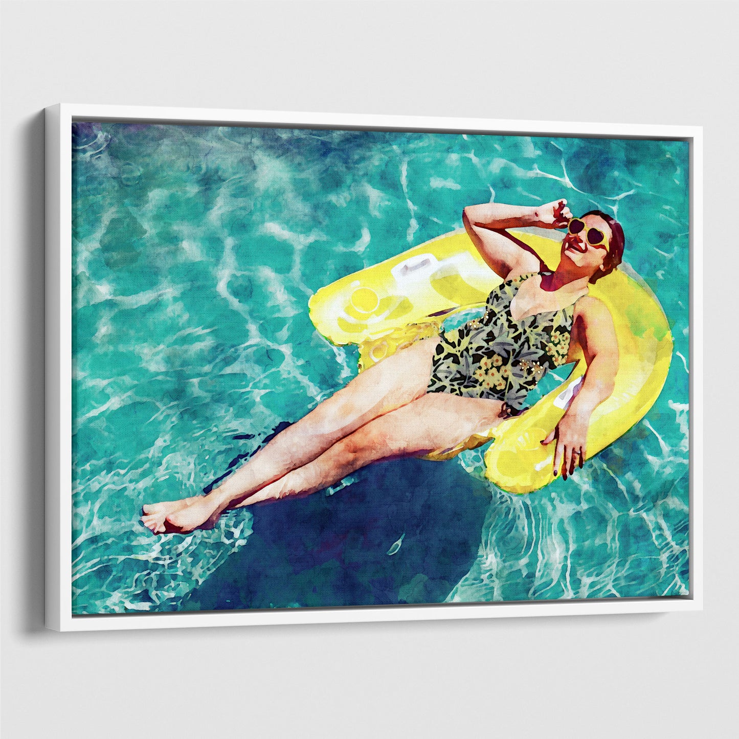 Woman wearing a floral swimsuit and sunglasses, lying on a yellow inflatable float in a pool, smiling and holding their sunglasses with one hand.  Watercolor painting printed on gallery wrap canvas in white floater frame.