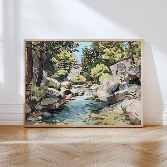 Framed landscape painting of a mountain stream flowing through large rocks and pine trees, with sunlight filtering through green foliage, leaning against a white wall on a wooden floor.