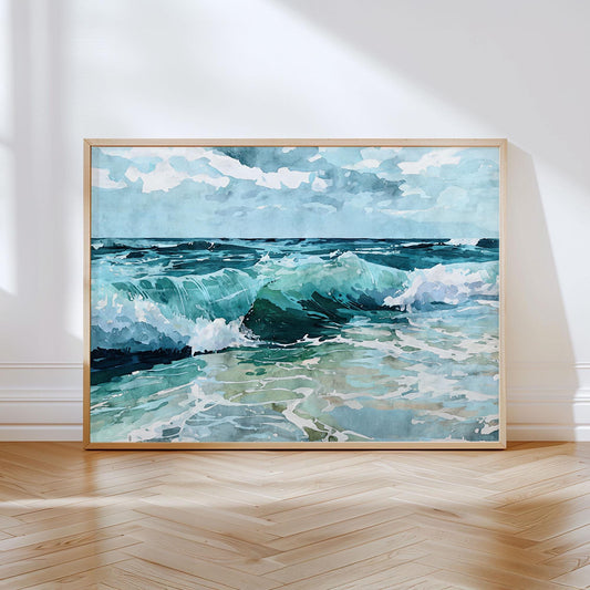 Framed watercolor painting of ocean waves crashing under a partly cloudy sky, with shades of turquoise, deep blue, and seafoam green, leaning against a white wall on a light wood herringbone floor.