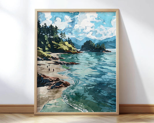 Framed watercolor-style art print of a coastal scene with turquoise waves, sandy beach, rocky shoreline, and tall evergreen trees on a cliffside under a bright sky with scattered clouds. Three small figures walk along the beach.